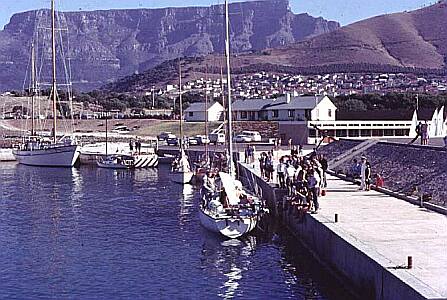The main quay with the Captain Superintendent's house & seamanship lecture rooms in the background. The yacht alongside is the original 'Voortrekker' on which Bruce Dalling won the single-handed trans-Alantic race in 1968.