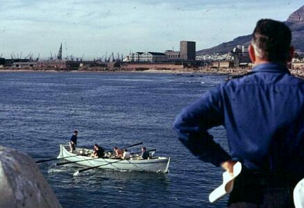 One of the whalers crewed by 'senior students' completing a pulling race against the cadets. Joe Almond looking on.
