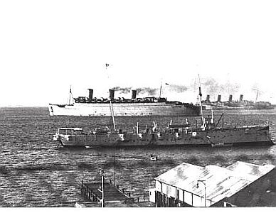 A clandestine photograph of the General Botha taken in the early years of WW II with Queen Mary and Aquitania at anchor in Simons Bay.