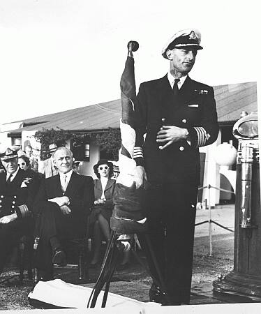 Captain Superintendent Legassick addresses guests and cadets. To his left are the CinC South Atlantic, and Captain Butters of the General Botha Board of Control.
