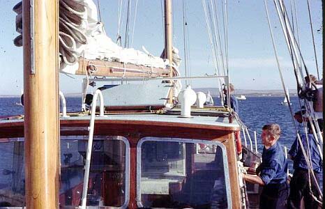 Clean ship on the Howard Davis in Saldanha Bay. 'JC' James doing his bit. Capt. Buchanan mostly obscured in the background.